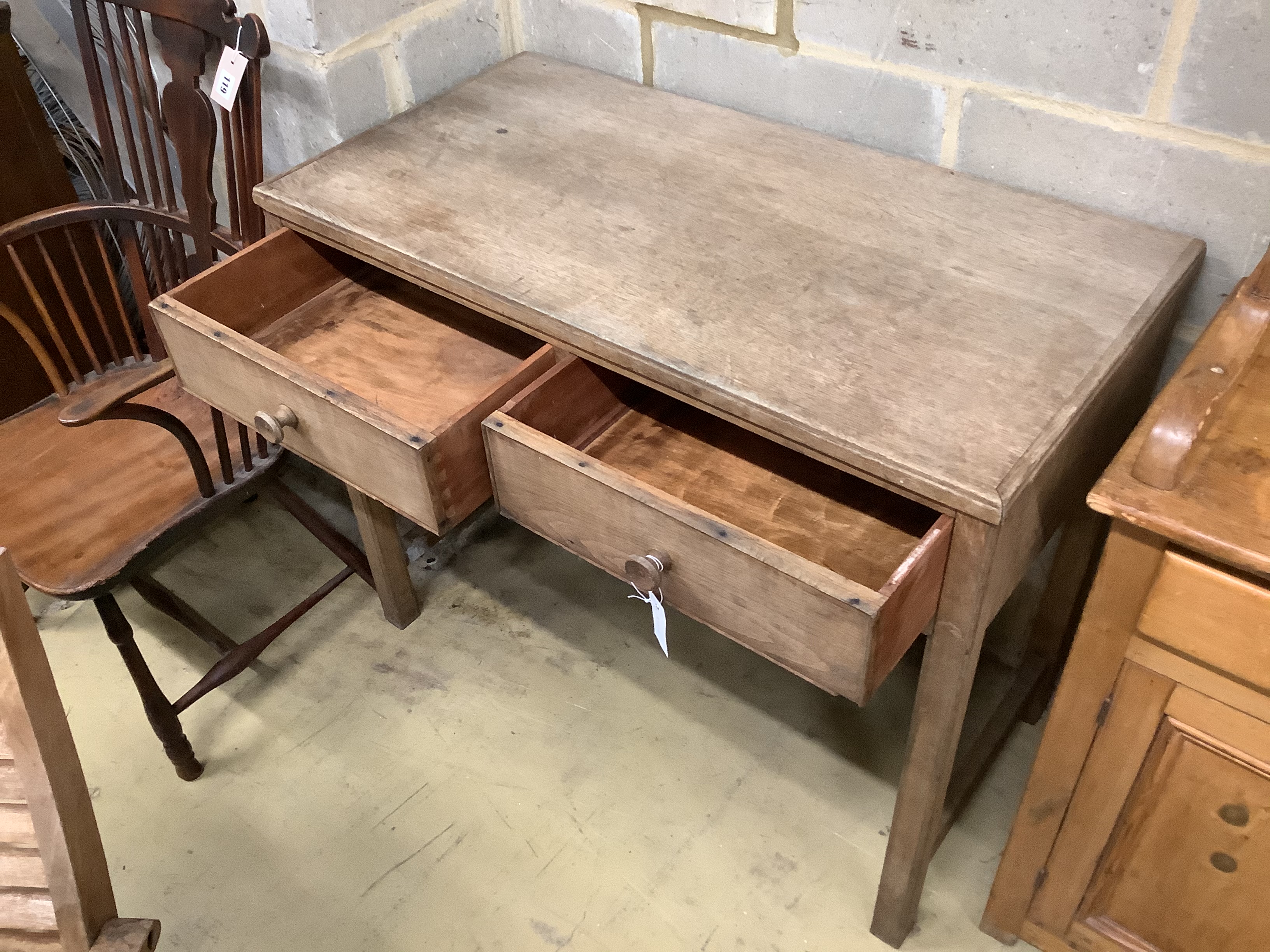 A Gordon Russell light oak two drawer side table, width 99cm, depth 50cm, height 82cm